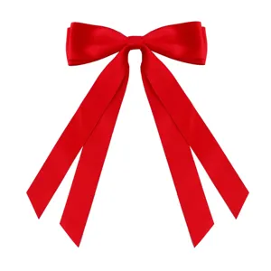 Detailed close-up of a large vibrant red satin ribbon bow with elegant long streamers