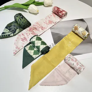 Detail view of multiple vintage French style long silk ribbons with various patterns.