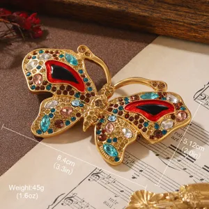 Macro detail showing dimensions and weight of the vintage butterfly rhinestone brooch.