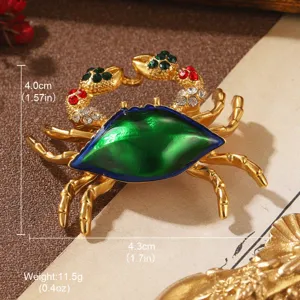 Close-up of a vintage crab brooch with green enamel shell and colorful crystals.