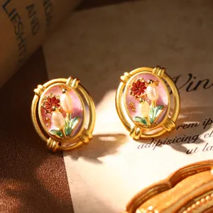 Detailed view of vintage French court style earrings with natural pearls and floral enamel