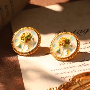 Detail of French vintage enamel flower earrings featuring Monet style oil painting design.