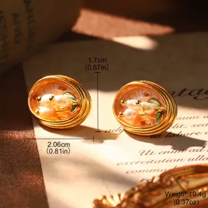 Macro detail of French vintage enamel earrings with pearls and size annotations