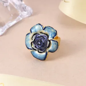 Close-up of elegant blue rose flower ring with gold-toned adjustable band