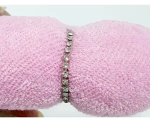 Close-up of sparkly rhinestone headband with padded sponge design for hair styling