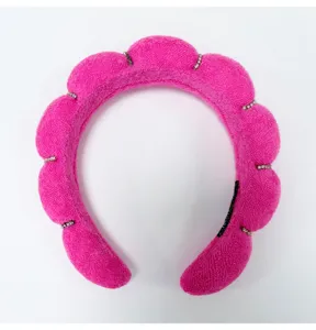 Close-up of hot pink padded cloud sponge headband with elegant rhinestone details.