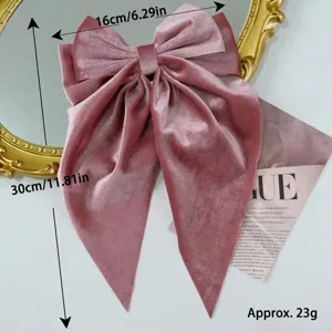 Large pink velvet hair bow with long streamers and vintage duckbill clip