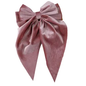 Elegant large velvet bow hair clip with long streamers in dusty pink.