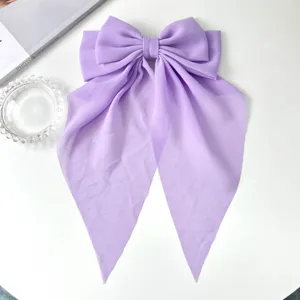 Elegant lavender chiffon oversized bow hair clip with long flowing streamers detail
