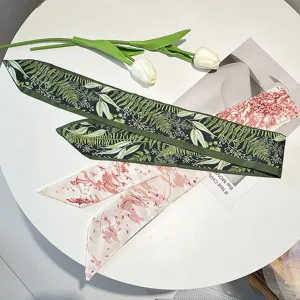 Close-up of vintage French style skinny hair ribbons with elegant botanical leaf prints