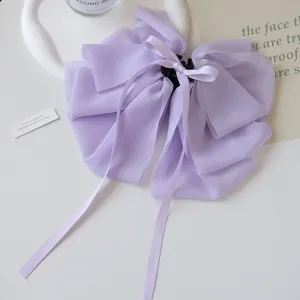 Detailed view of the elegant lavender chiffon bow claw clip with long ribbons