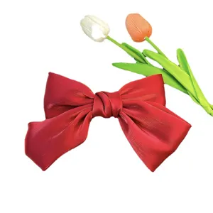 Elegant large shiny red silk bow hair clip with a classic high-end Korean style design