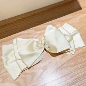 Elegant cream satin oversized bow hair clip with pearl and rhinestone detail