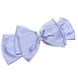 Oversized lavender satin French bow hair clip embellished with pearl and rhinestone detail