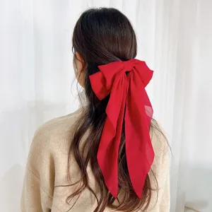 Elegant large red chiffon bow hair clip with long streamers for women's hairstyle