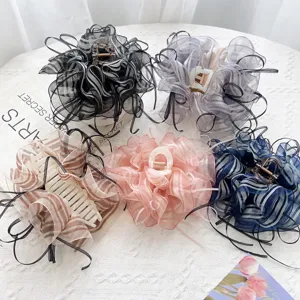 Group of elegant organza bow hair claw clips in various striped colors for women.