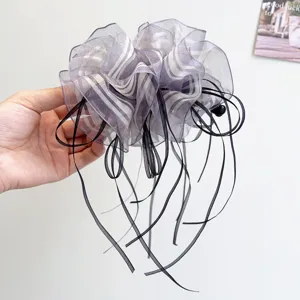Elegant purple striped sheer fabric banana hair clip with long black ribbons detail view