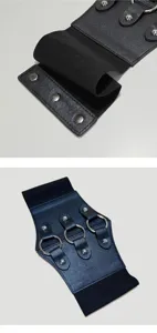 Close-up details of the black elastic wide waist belt featuring metal rings and chic rivet decor.