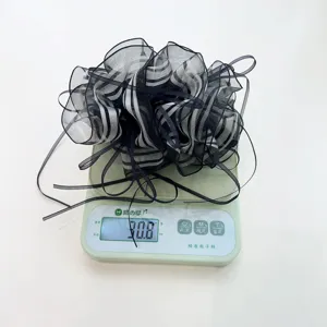 Detailed view of the elegant black and white striped ribbon hair clip weighing 30.8g
