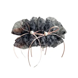 Barrette banane élégante en mesh léopard avec rubans roses et perles fantaisies.