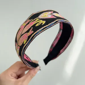 Detailed view of Bohemian floral embroidered wide headband with vintage ethnic style