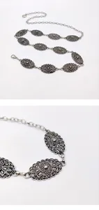 Close-up detail and layout view of the silver vintage ethnic embossed metal waist chain.