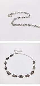 Detailed view of the silver metal retro carved waist chain showing exquisite decorative links.