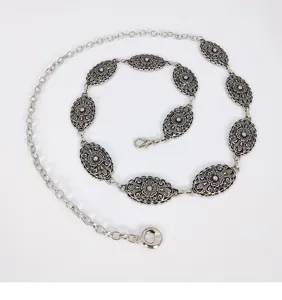 Silver vintage ethnic embossed waist chain, retro metal dress belt accessory, elegant.