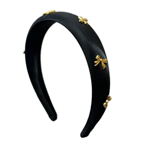Elegant black satin sponge padded headband with delicate golden metal bow charms