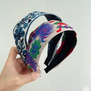 Detailed view of bohemian ethnic fabric headband with vintage floral patterns