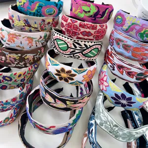 Collection of vibrant Bohemian embroidered wide headbands featuring ethnic floral patterns.