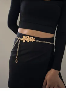 Gold flower body chain for women, boho waist chain tassel belt, fashion metal accessory.