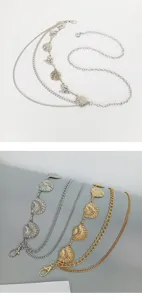 Multi-layer metal waist chain featuring shell and conch pendants, perfect for dresses or jeans.