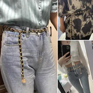 Ceinture chaîne métal doré chic pour femme avec tissage cuir noir et pendentif pièce accessoire.