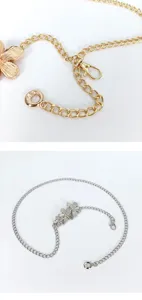 Women metallic flower waist chain bohemian beach body jewelry delicate link accessory detail.