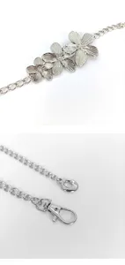 Silver metal waist chain detail featuring three floral charms and lobster clasp for women.