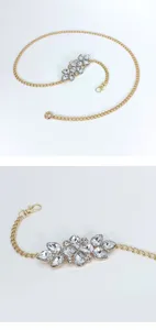 Crystal rhinestone floral waist chain detail shot, gold metal body chain for women beach.