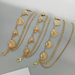 Gold multi-layer waist chain with ocean shell and conch charms, stylish belt for women dress.