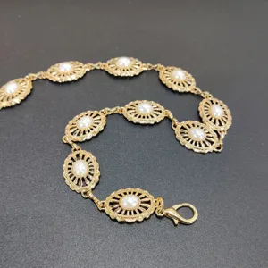 Vintage gold metal waist chain with faux pearl oval links, stylish dress decorative belt.