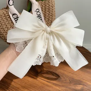 Elegant oversized white lace double-layer bow hair clip for a sophisticated look