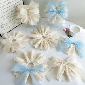Lace ruffle scrunchies and bow hair claws collection in cream and blue colors