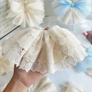 Detailed view of an oversized cream double-layered lace flower hair claw clip for women