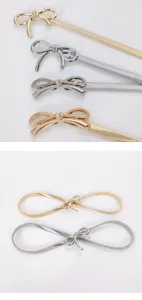 Metallic bow elastic waist chain detail, elegant silver and gold belt for dresses and skirts.