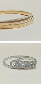 Women's metallic elastic waist belt with rhinestone buckle, stylish dress and sweater accessory.