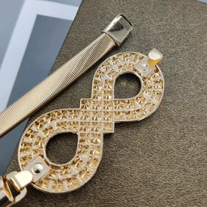 Gold elastic stretch metal waist belt with rhinestone infinity buckle for dresses and sweaters.