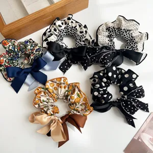 Collection of patterned fabric hair scrunchies with elegant silk bowknots
