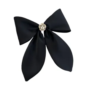 Elegant black satin bow hair clip with white camellia flower and pearl accents for women