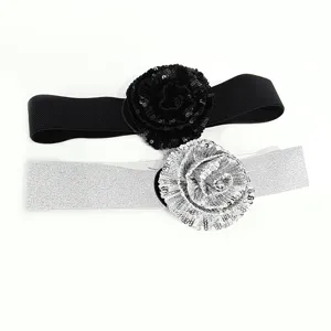 Fashion elastic waist belt with sparkling sequin flower, perfect for dresses and sweaters.