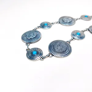 Bohemian metal waist chain for women, vintage engraved round coin belt for dresses and sweaters.