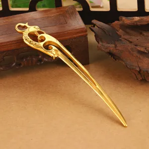 Detailed close-up view of a premium golden hollow dragon hair fork for Hanfu wear.